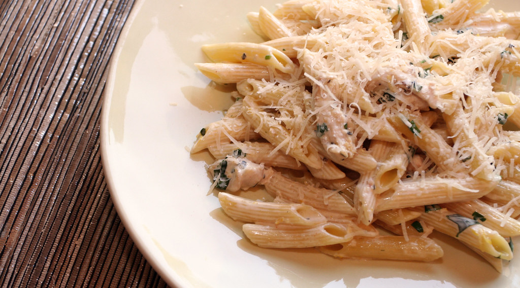 Pasta with chicken fillet in creamy cheese sauce